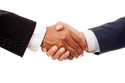 Multiracial handshake between african and a caucasian business man, isolated on white